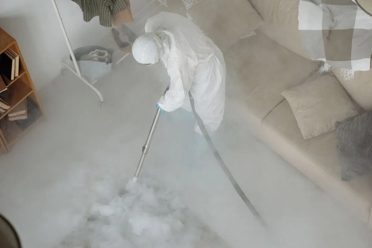 Biohazard cleanup technician in protective equipment, Coaling, AL